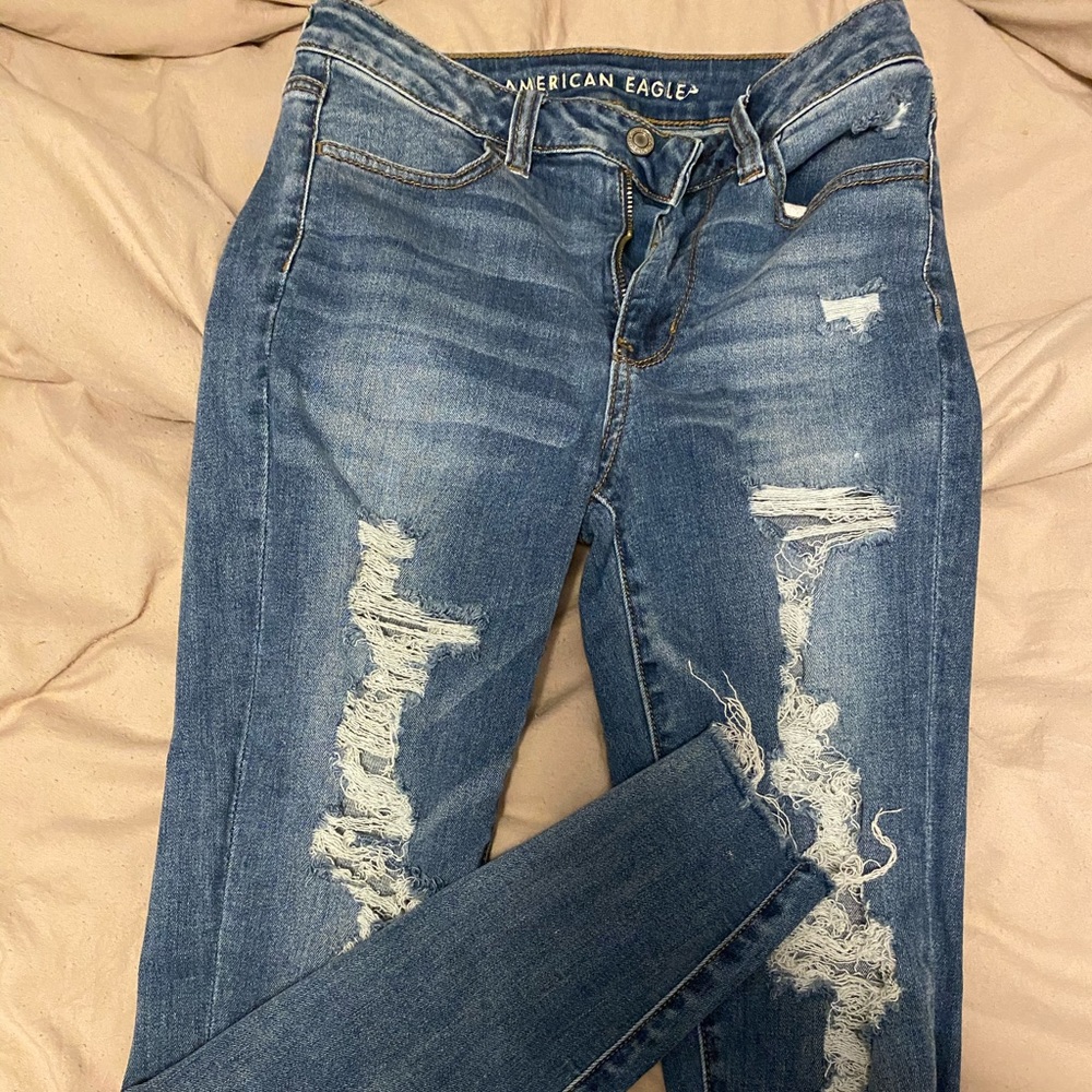 Distressed denim jeans